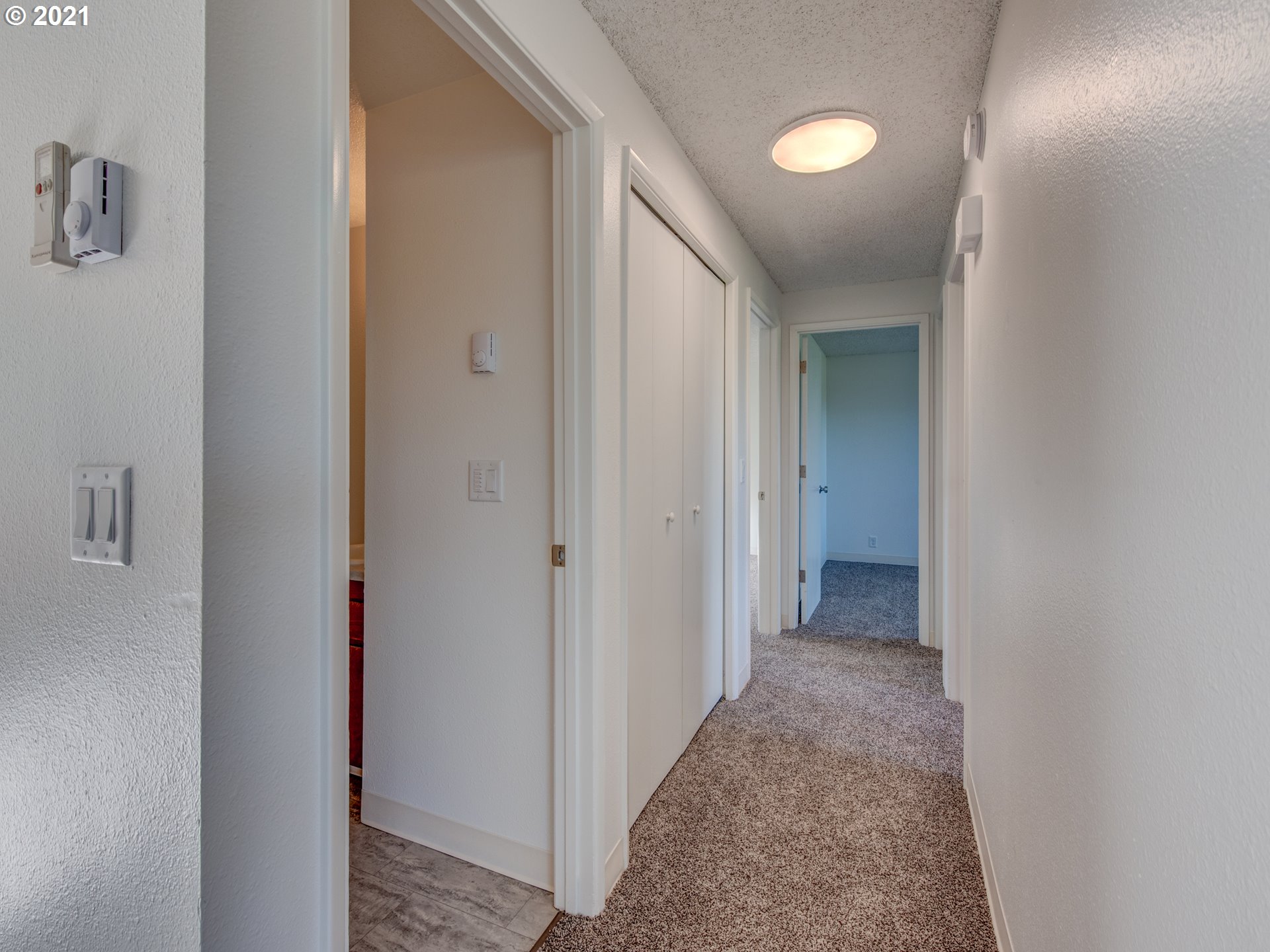 4850 Jessen Drive Eugene, OR 97402 - Photo 18 of 22 a view of a hallway with wooden shelves