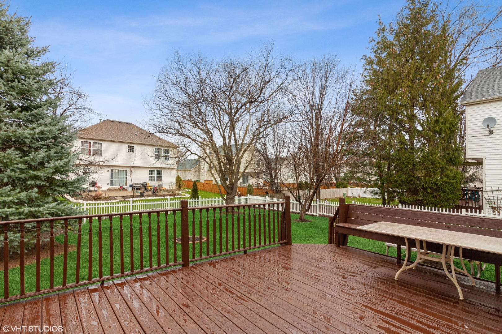 1846 Brookstone Court Romeoville, IL 60446 - Photo 21 of 27 a view of a deck with a table and chairs with wooden fence