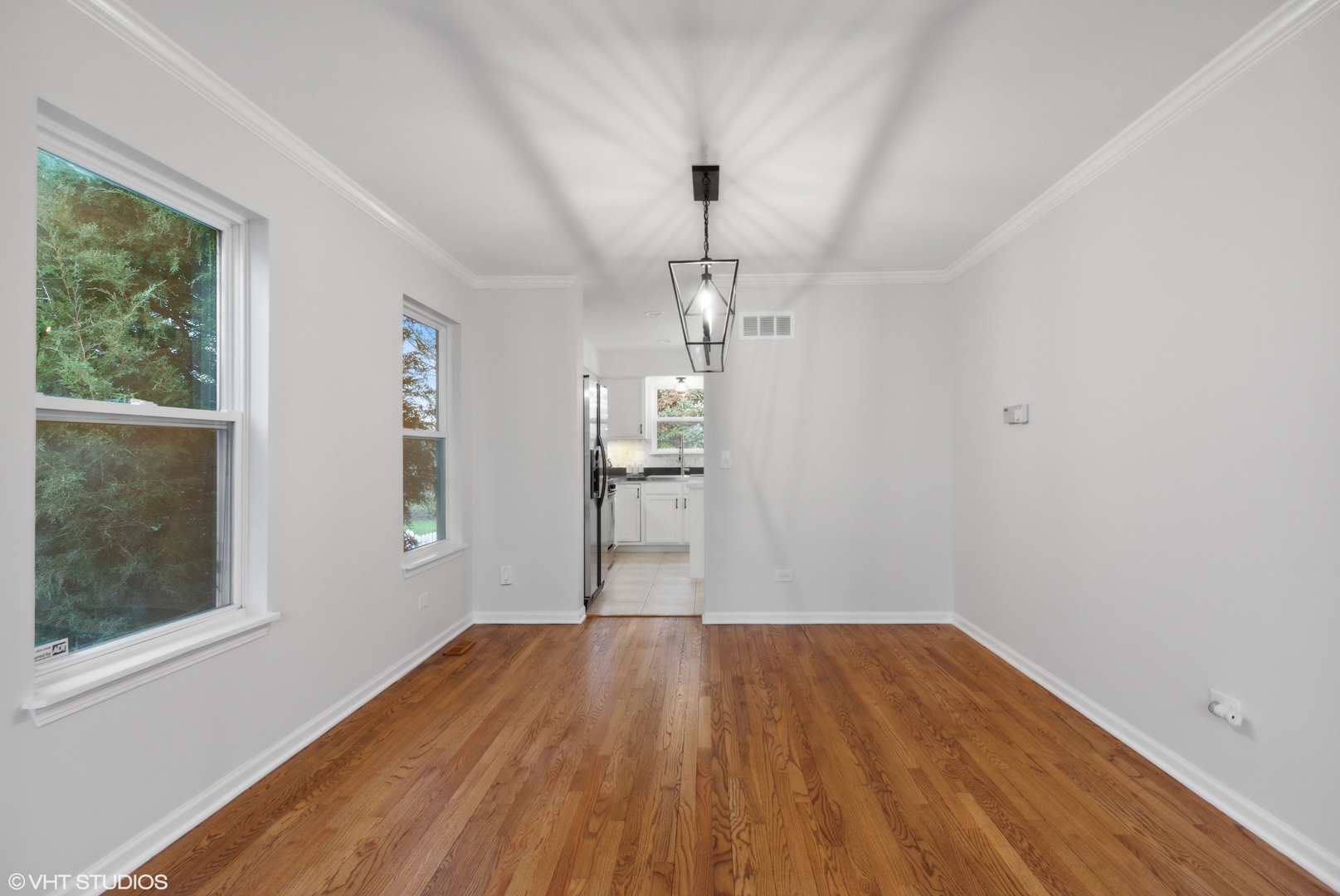 1846 Brookstone Court Romeoville, IL 60446 - Photo 6 of 27 a view of empty room with wooden floor and fan