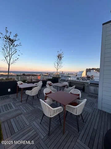 a view of a big yard with table and chairs