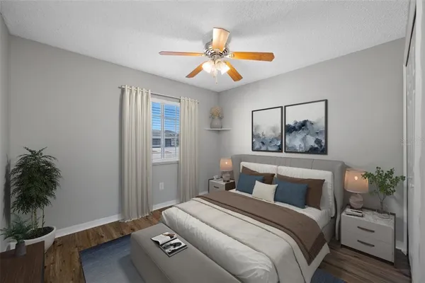 a bedroom with a bed and a chandelier