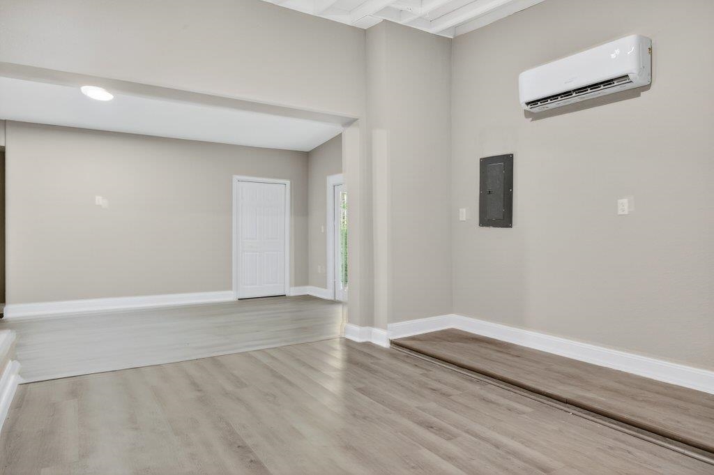 125 Menendez Road St. Augustine, FL 32080 - Photo 25 of 41 a view of an empty room with wooden floor