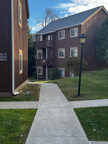 a front view of a house with yard