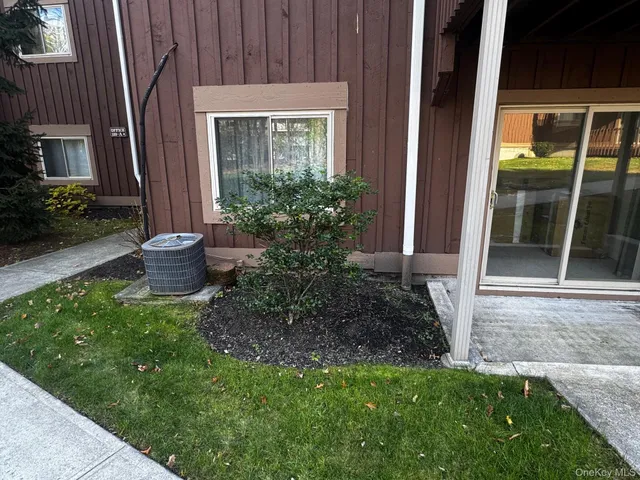 a view of a backyard with potted plants