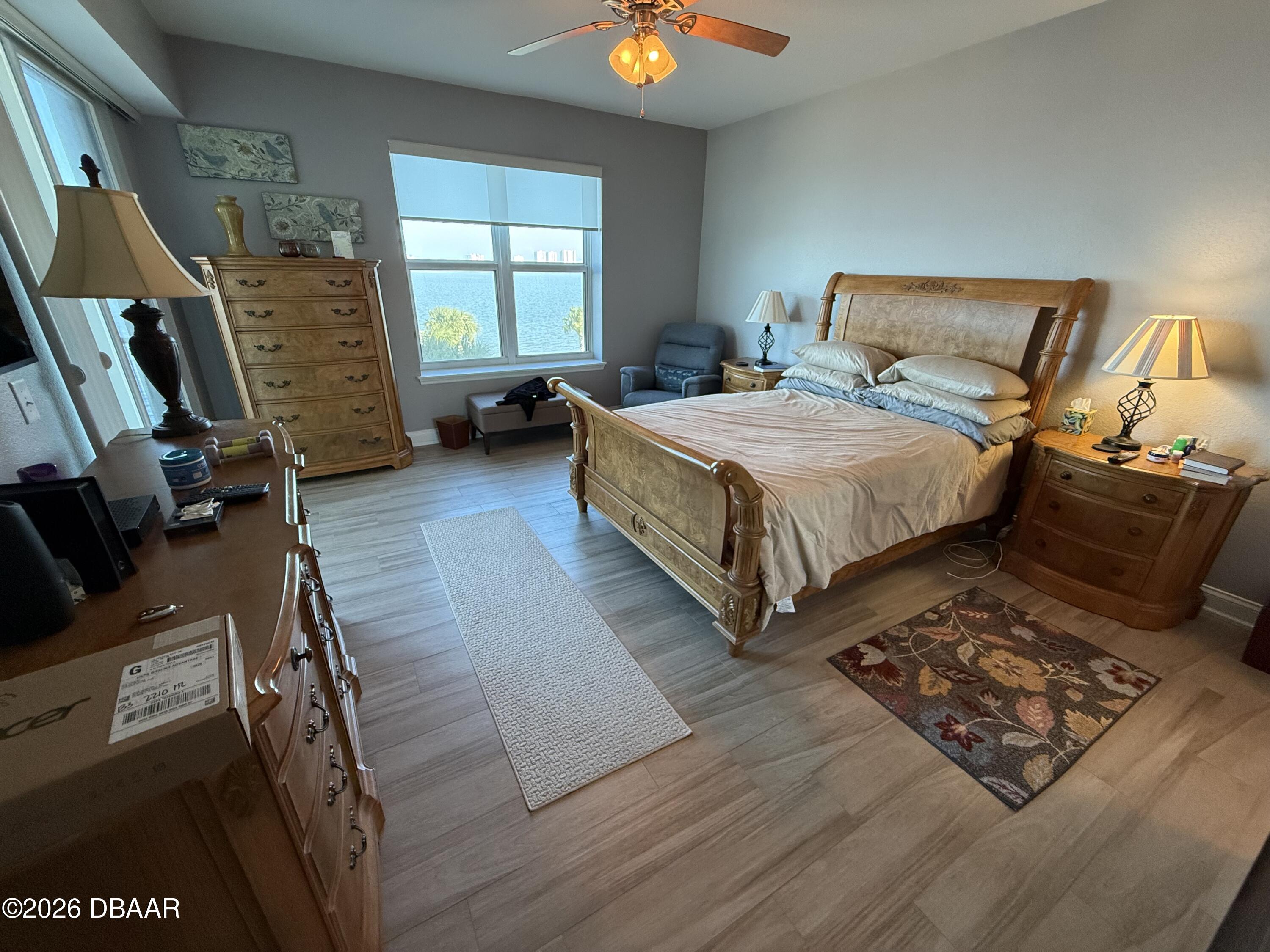 2801 South Ridgewood Avenue, Unit 409 South Daytona, FL 32119 - Photo 12 of 23 a bed room with a bed and a window