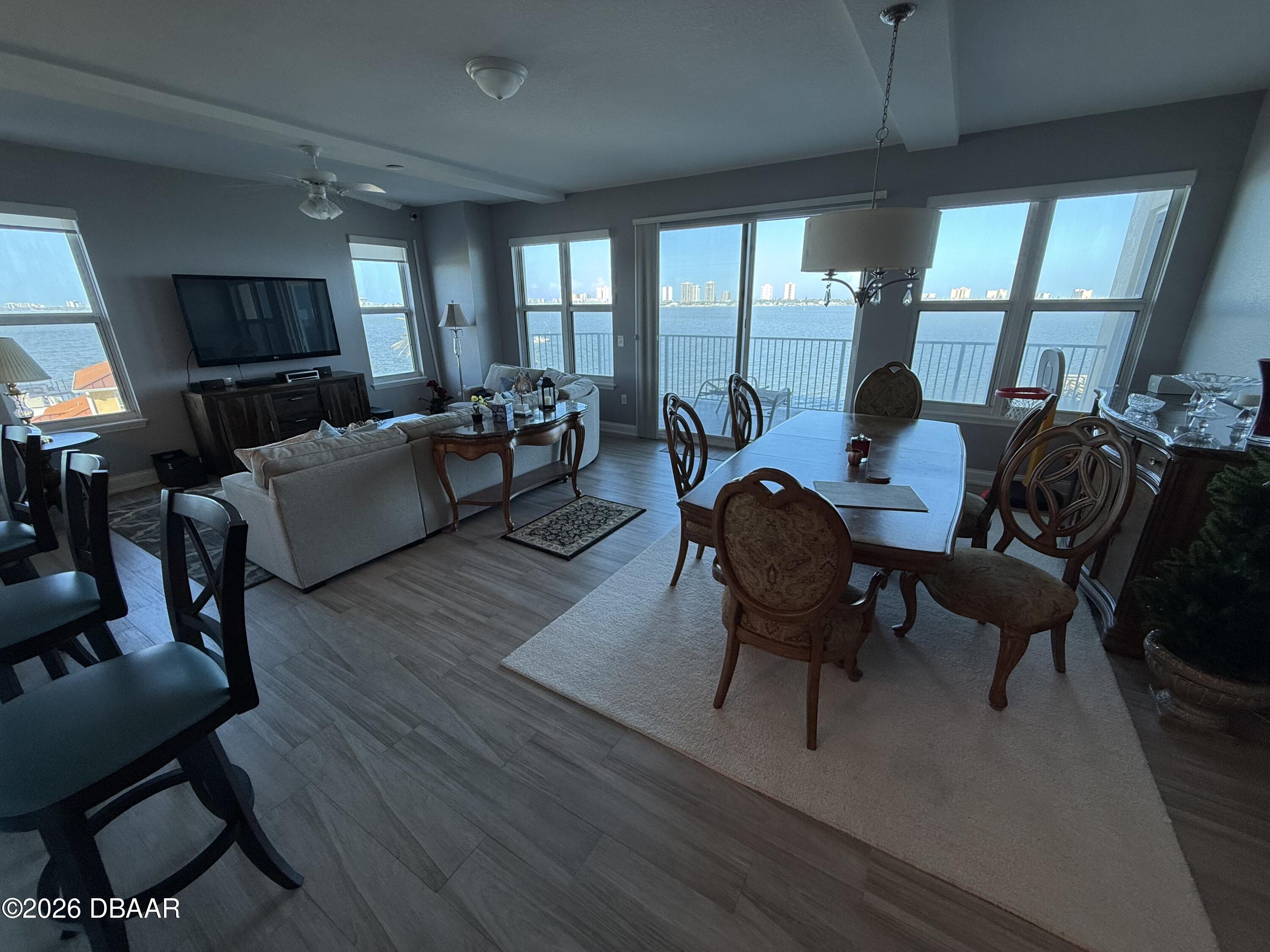 2801 South Ridgewood Avenue, Unit 409 South Daytona, FL 32119 - Photo 5 of 23 a living room with furniture and a large window