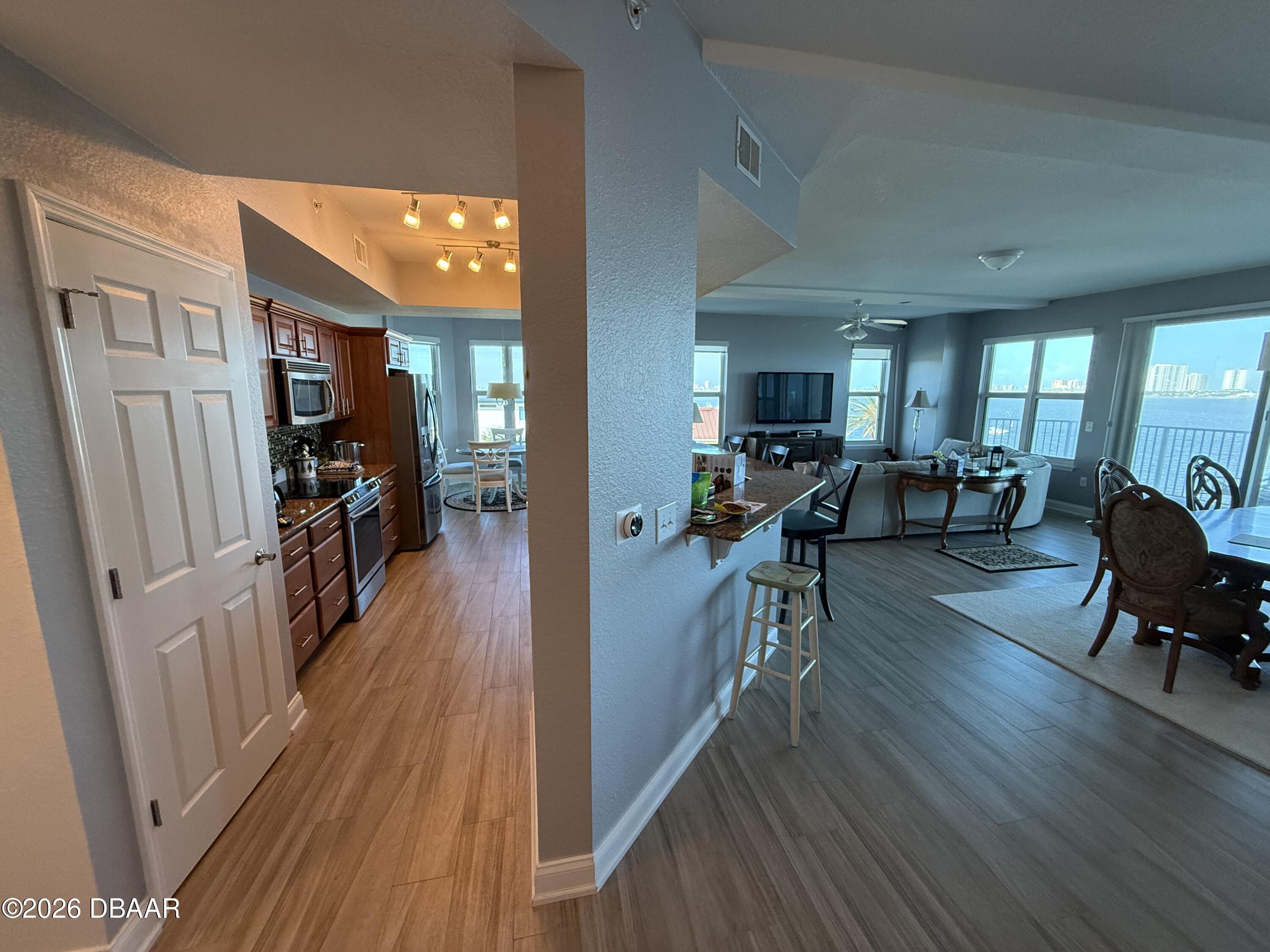 2801 South Ridgewood Avenue, Unit 409 South Daytona, FL 32119 - Photo 6 of 23 a view of a living room and dining room