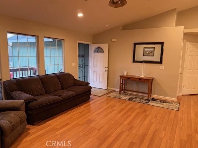 18992 Redbud Road Hidden Valley Lake, CA 95467 - Photo 11 of 39 a living room with a couch and a wooden floor