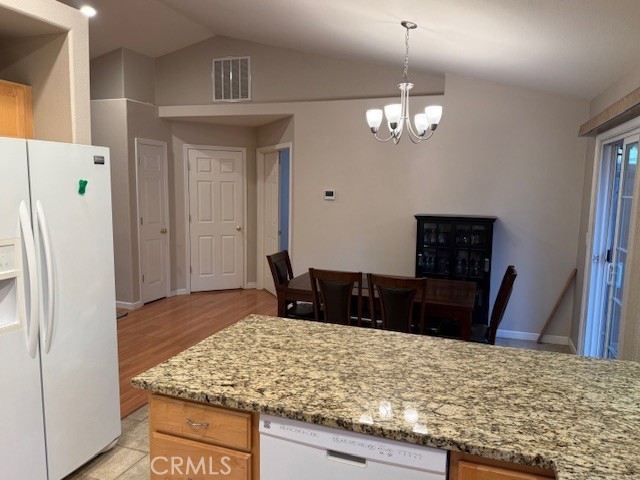 18992 Redbud Road Hidden Valley Lake, CA 95467 - Photo 15 of 39 a living room with stainless steel appliances granite countertop furniture a refrigerator and wooden floor