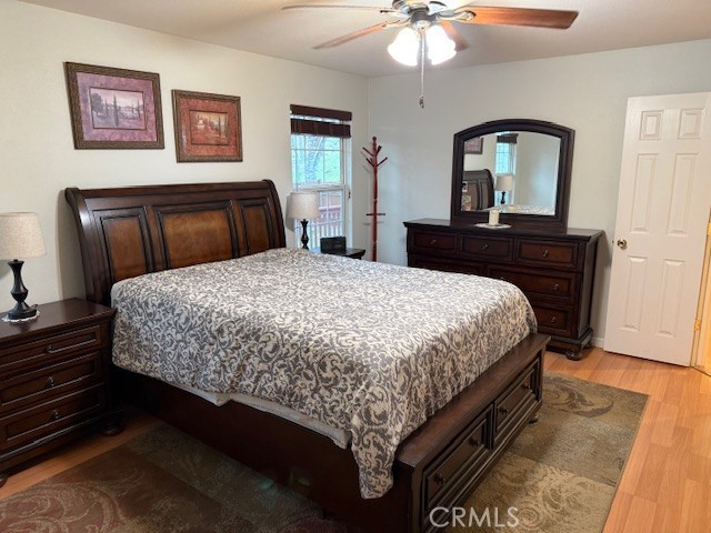 18992 Redbud Road Hidden Valley Lake, CA 95467 - Photo 19 of 39 a bedroom with a bed and a mirror on dresser