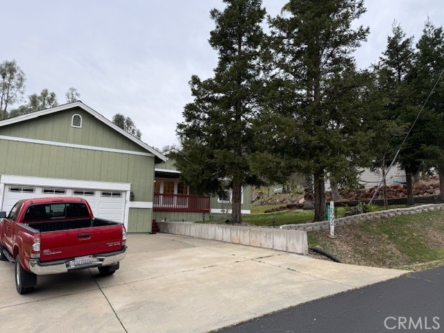 18992 Redbud Road Hidden Valley Lake, CA 95467 - Photo 2 of 39 a front view of a house with a garden