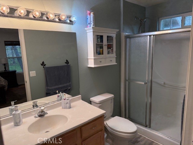 18992 Redbud Road Hidden Valley Lake, CA 95467 - Photo 21 of 39 a bathroom with a sink toilet and shower