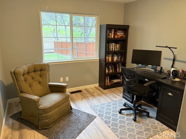 18992 Redbud Road Hidden Valley Lake, CA 95467 - Photo 23 of 39 a living room with furniture and a window