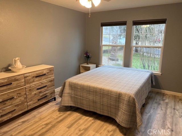 18992 Redbud Road Hidden Valley Lake, CA 95467 - Photo 24 of 39 a bedroom with a bed and a window