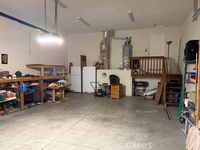 18992 Redbud Road Hidden Valley Lake, CA 95467 - Photo 27 of 39 a view of a garage with stuff