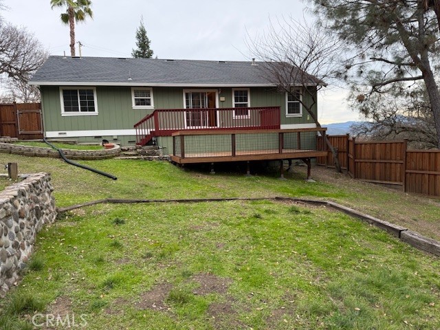 18992 Redbud Road Hidden Valley Lake, CA 95467 - Photo 30 of 39 a backyard of a house with barbeque oven table and chairs