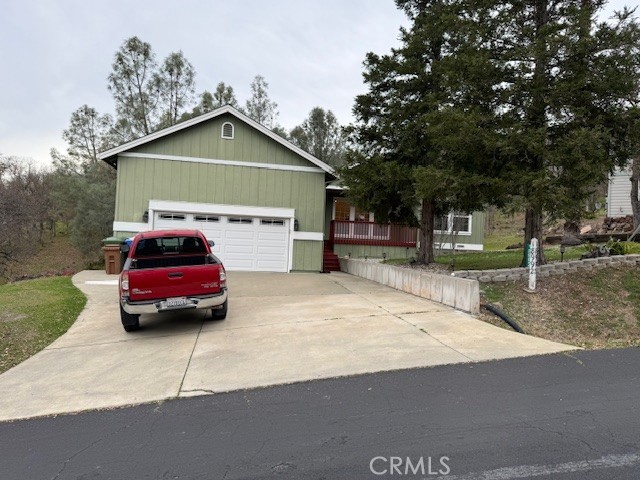 18992 Redbud Road Hidden Valley Lake, CA 95467 - Photo 3 of 39 a car parked in front of house