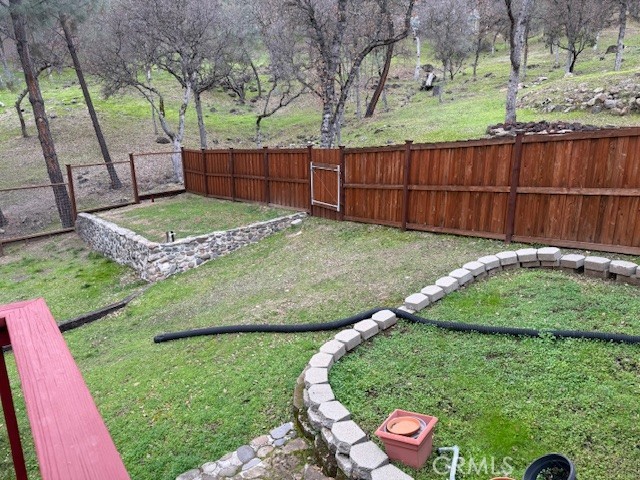 18992 Redbud Road Hidden Valley Lake, CA 95467 - Photo 36 of 39 a view of a backyard with wooden fence