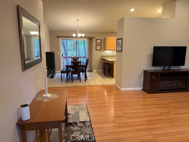 18992 Redbud Road Hidden Valley Lake, CA 95467 - Photo 9 of 39 a view of a dining room with furniture and a flat screen tv