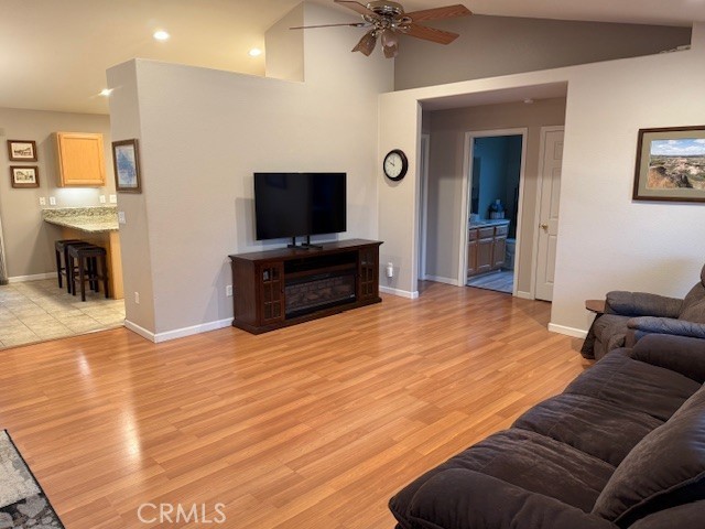 18992 Redbud Road Hidden Valley Lake, CA 95467 - Photo 10 of 39 a living room with furniture and a flat screen tv