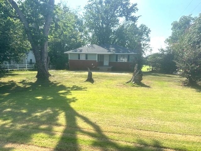 373 Washington Street Ripley, TN 38063 - Photo 1 of 19 a swimming pool with trees in the background