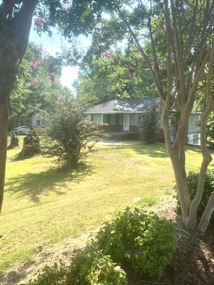 373 Washington Street Ripley, TN 38063 - Photo 2 of 19 a view of an ocean a building and trees in the background