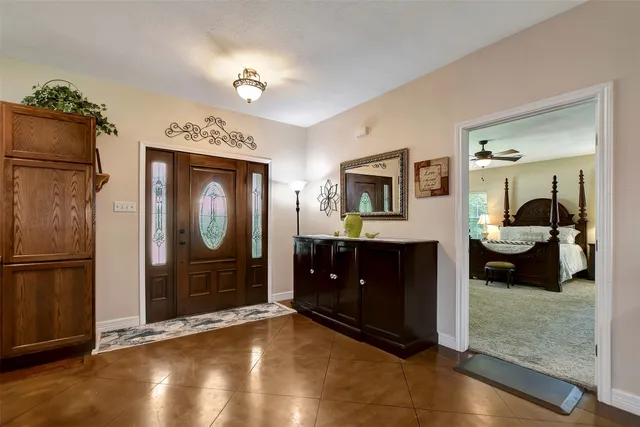 a living room with furniture and a bathroom