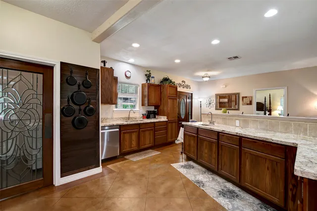 a large bathroom with a large mirror vanity and shower