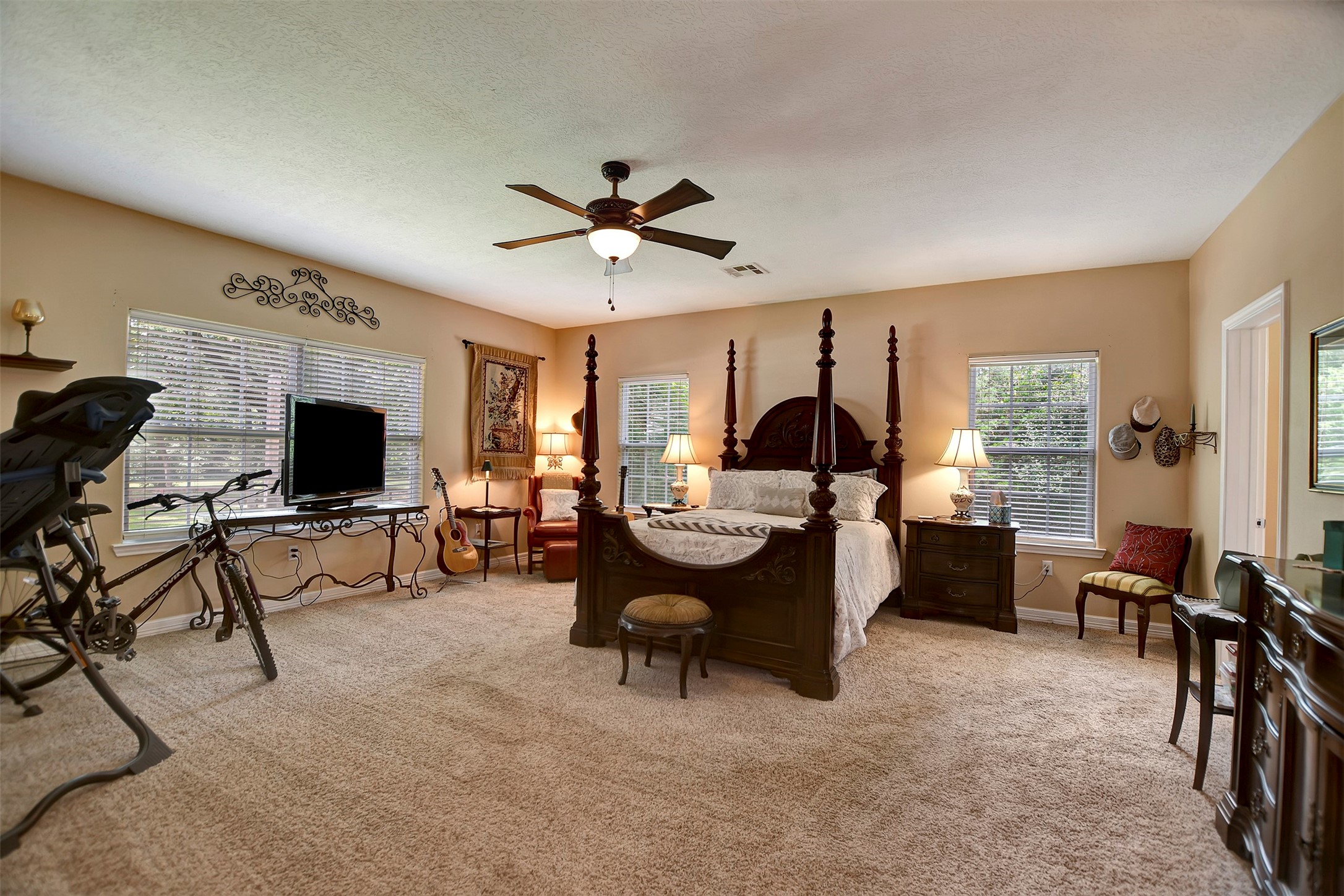 28030 Highway 6 Hempstead, TX 77445 - Photo 22 of 50 a living room with furniture flat screen tv and a fireplace