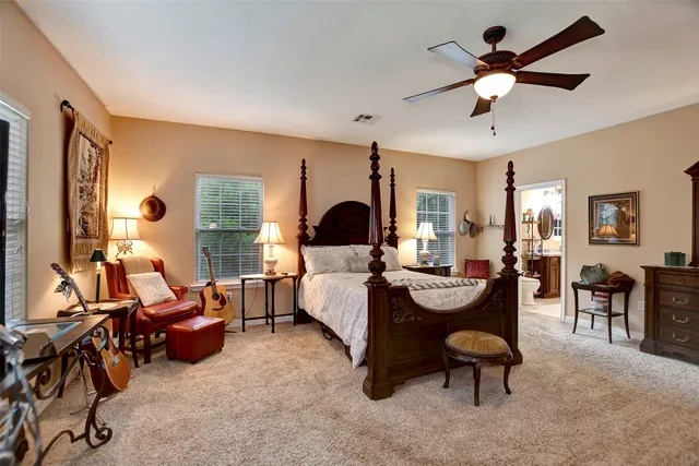 a living room with furniture flat screen tv and a fireplace