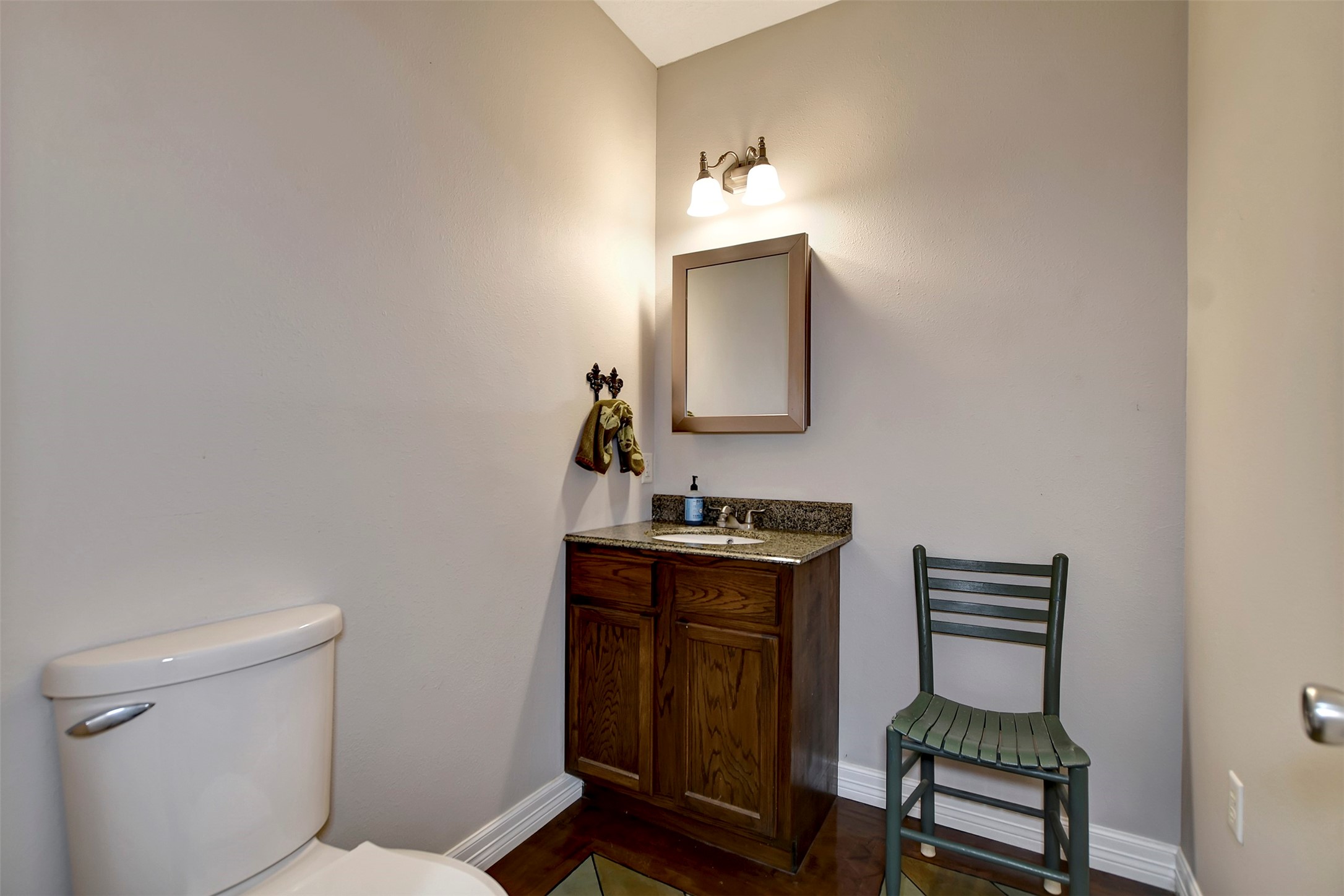 28030 Highway 6 Hempstead, TX 77445 - Photo 27 of 50 a bathroom with a toilet a sink and mirror
