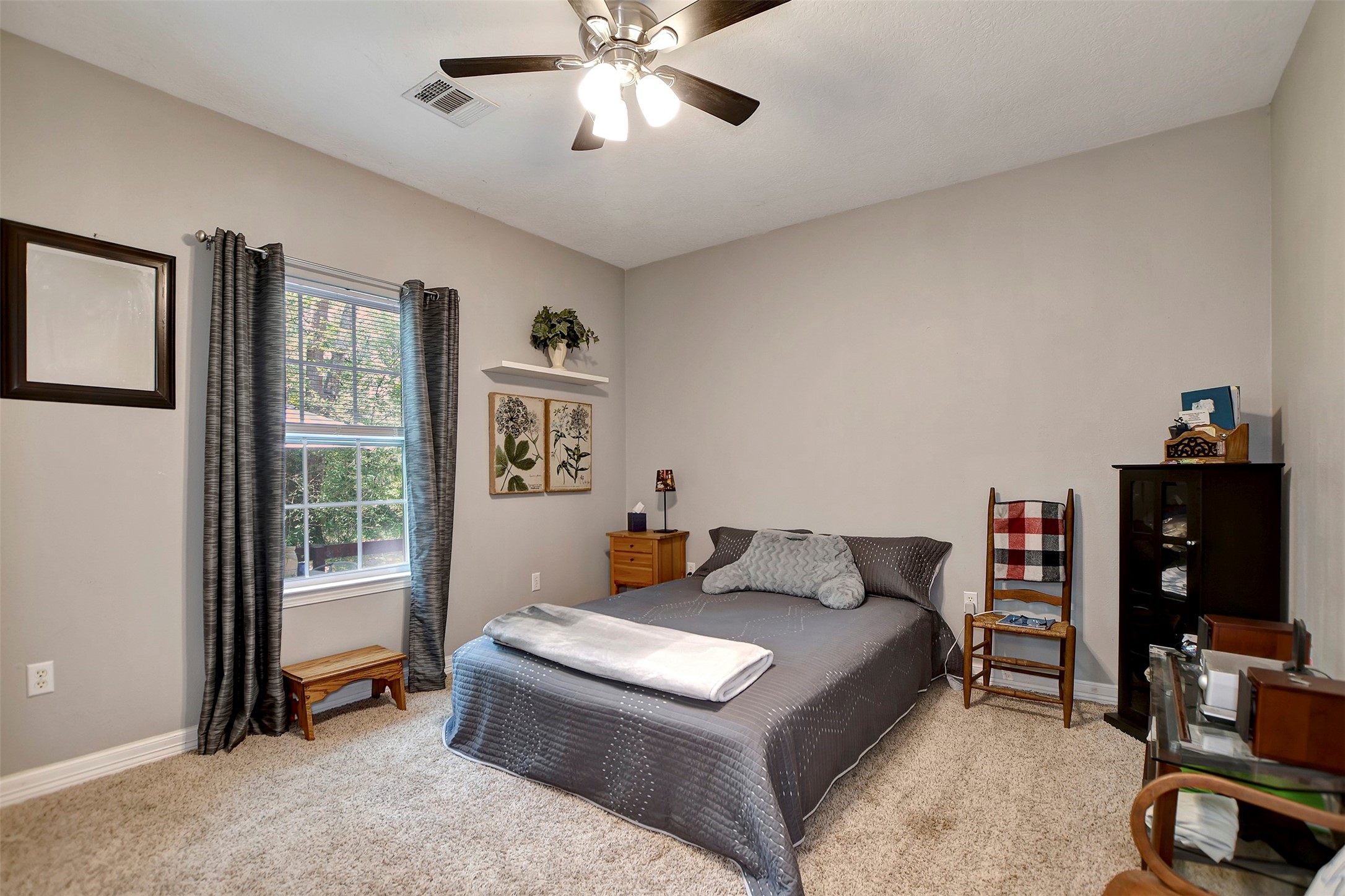 28030 Highway 6 Hempstead, TX 77445 - Photo 29 of 50 a bedroom with a bed and a chandelier