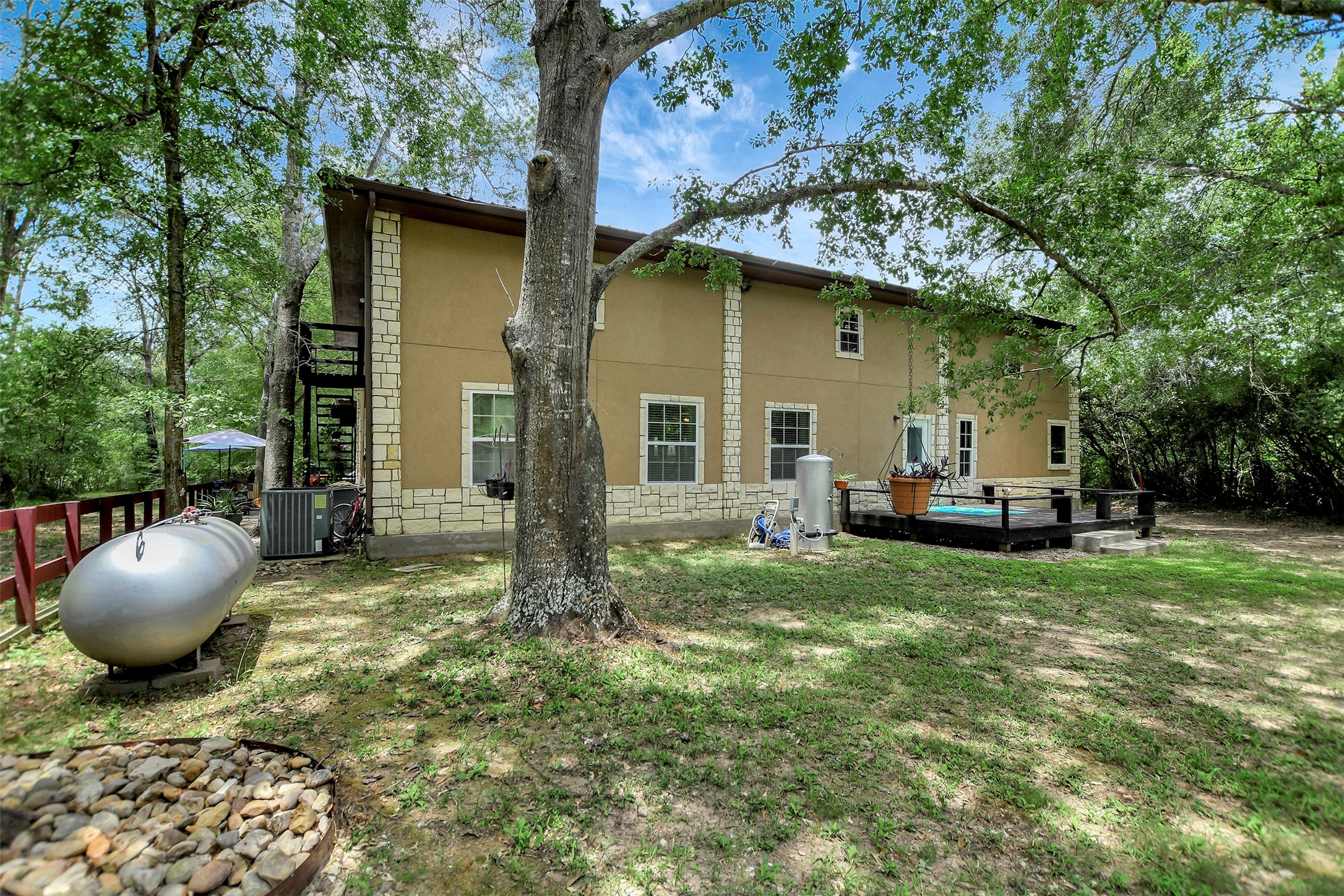 28030 Highway 6 Hempstead, TX 77445 - Photo 34 of 50 a view of a backyard with table and chairs and potted plants