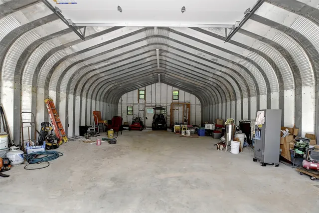 a backyard of a house with a garden and deck