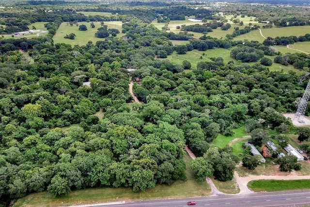 a view of a green yard with a house