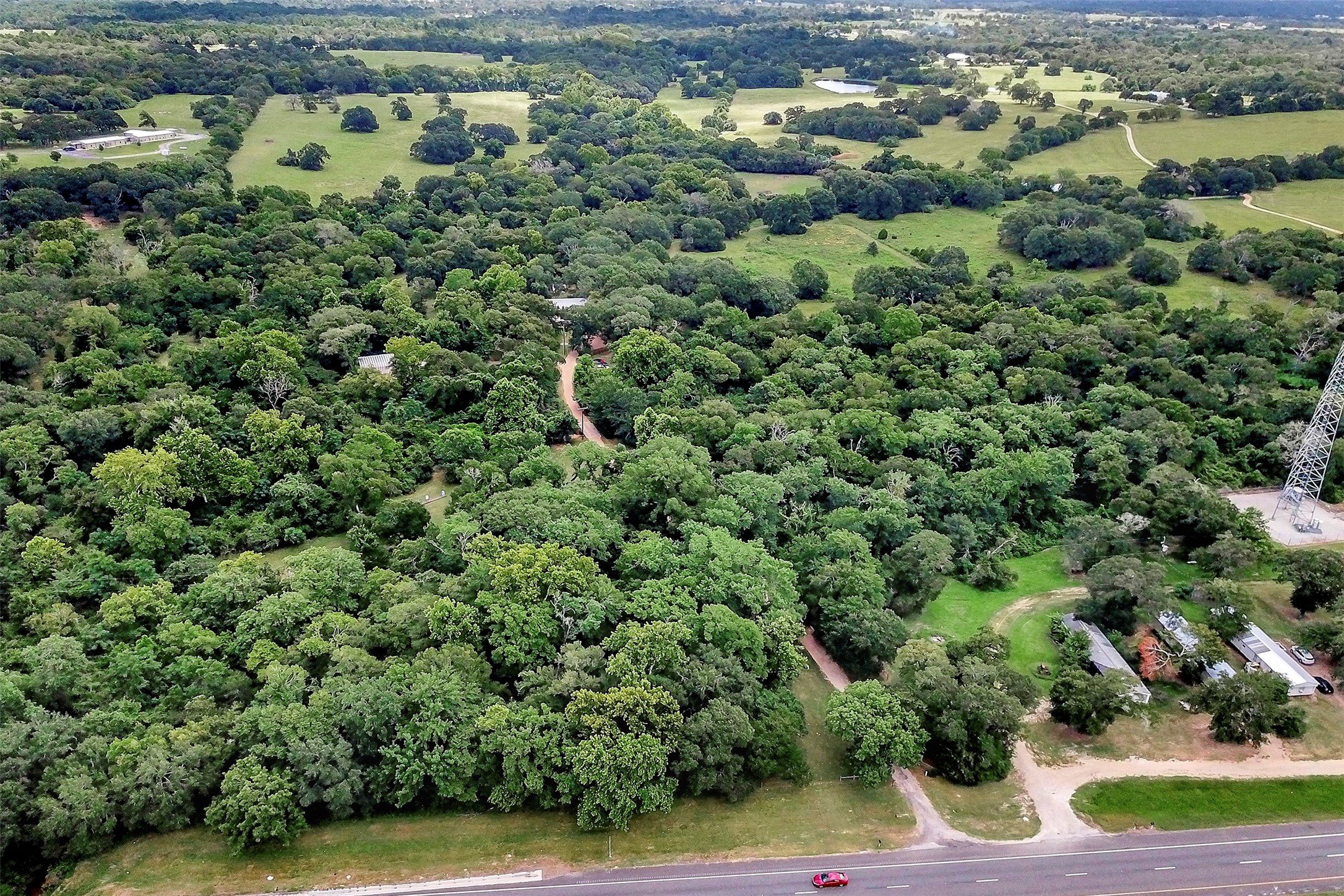 28030 Highway 6 Hempstead, TX 77445 - Photo 43 of 50 an aerial view of residential houses with outdoor space and trees