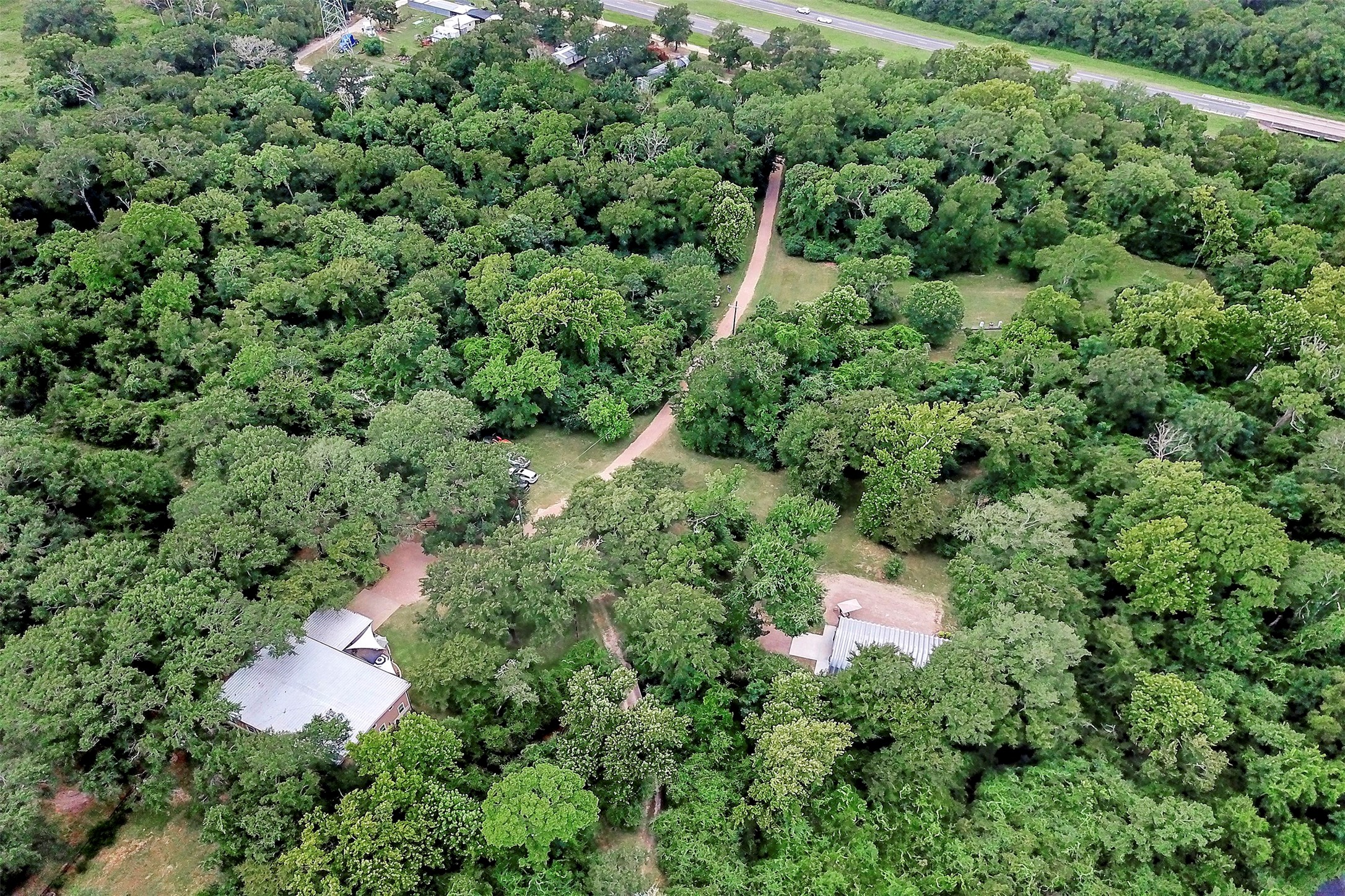 28030 Highway 6 Hempstead, TX 77445 - Photo 47 of 50 an aerial view of residential house with outdoor space and trees all around