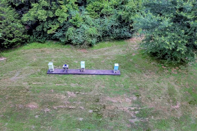 an aerial view of a houses with a yard