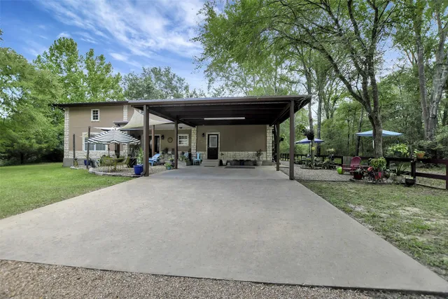 a view of a car park in front of a house