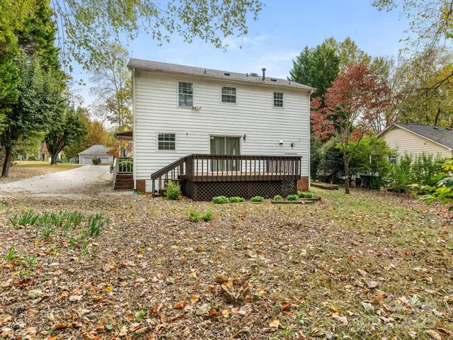an aerial view of a house with a swimming pool