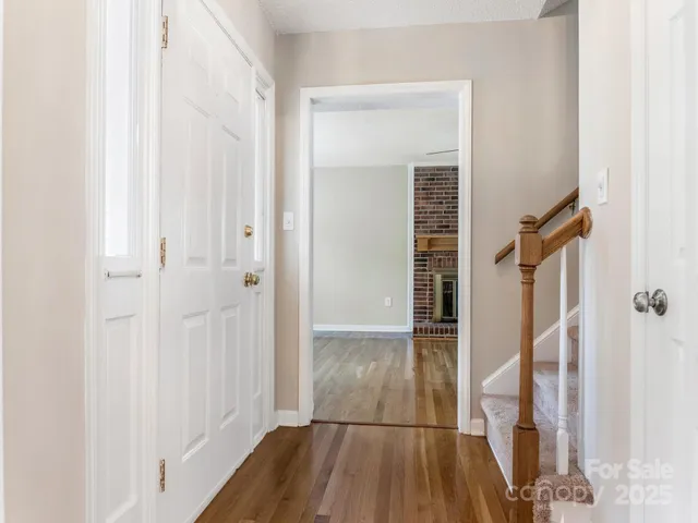 a kitchen with a refrigerator sink stove and cabinets