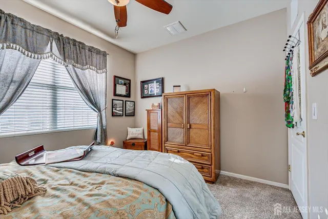 a bedroom with a bed and a closet