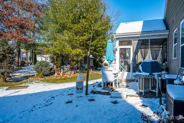 swimming pool view with a seating space