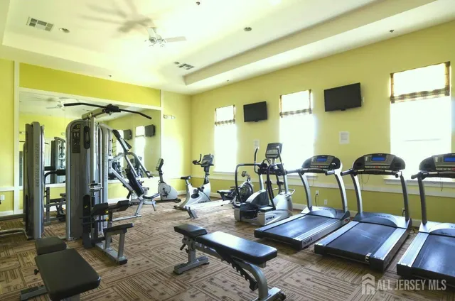 a living room with lots of furniture and a view of living room