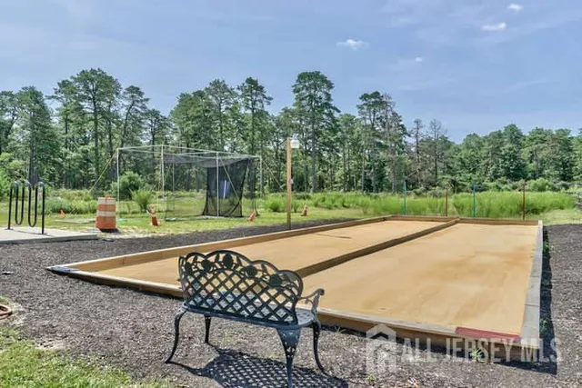 a view of entryway with wooden floor and a shower