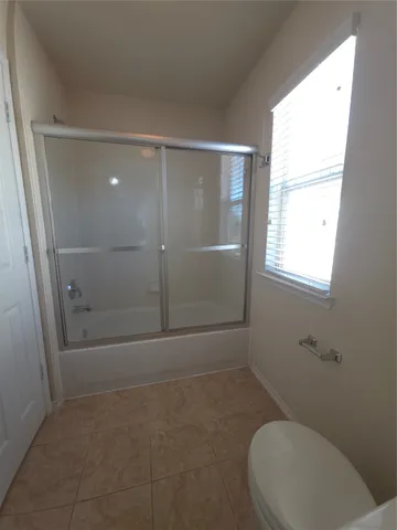 a spacious bathroom with a double vanity sink and a mirror