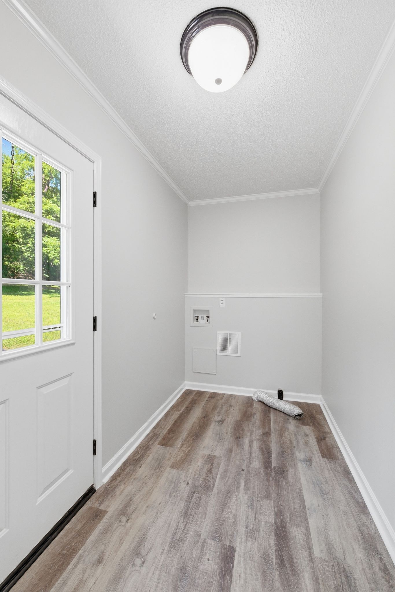 1021 B Jordan Road Lascassas, TN 37085 - Photo 26 of 58 a view of a room with wooden floor and windows