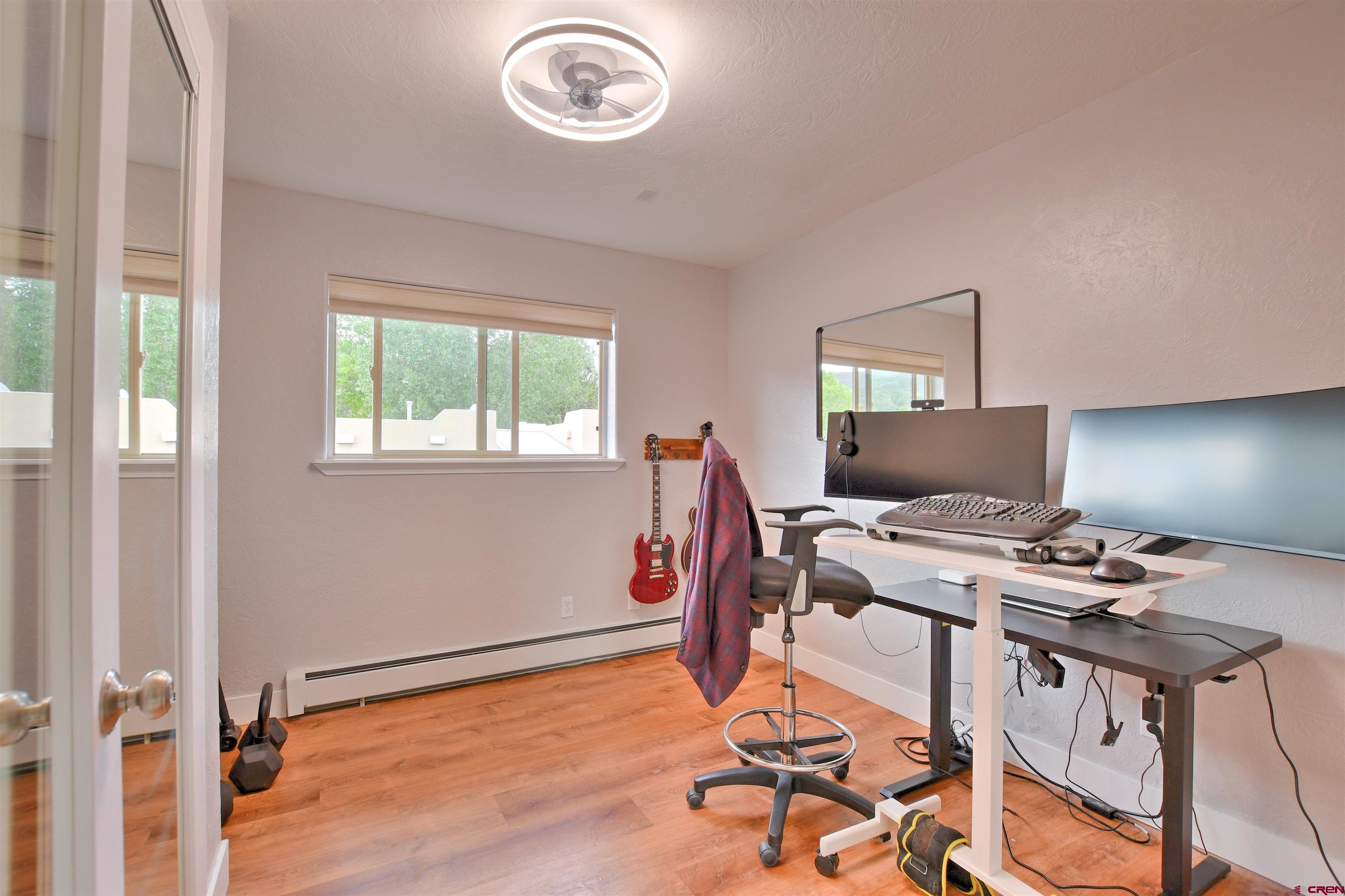 602 Chipeta Drive Ridgway, CO 81432 - Photo 23 of 41 a view of a workspace with furniture and a window