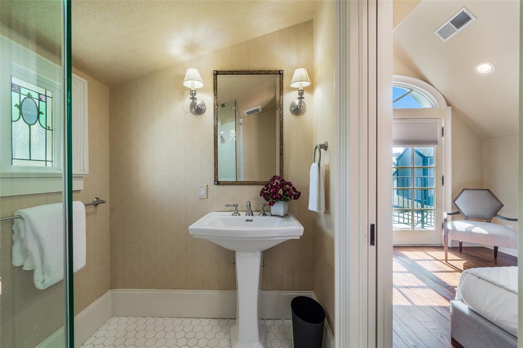 2315 Routh Street Dallas, TX 75201 - Photo 24 of 38 a bathroom with a sink and a mirror