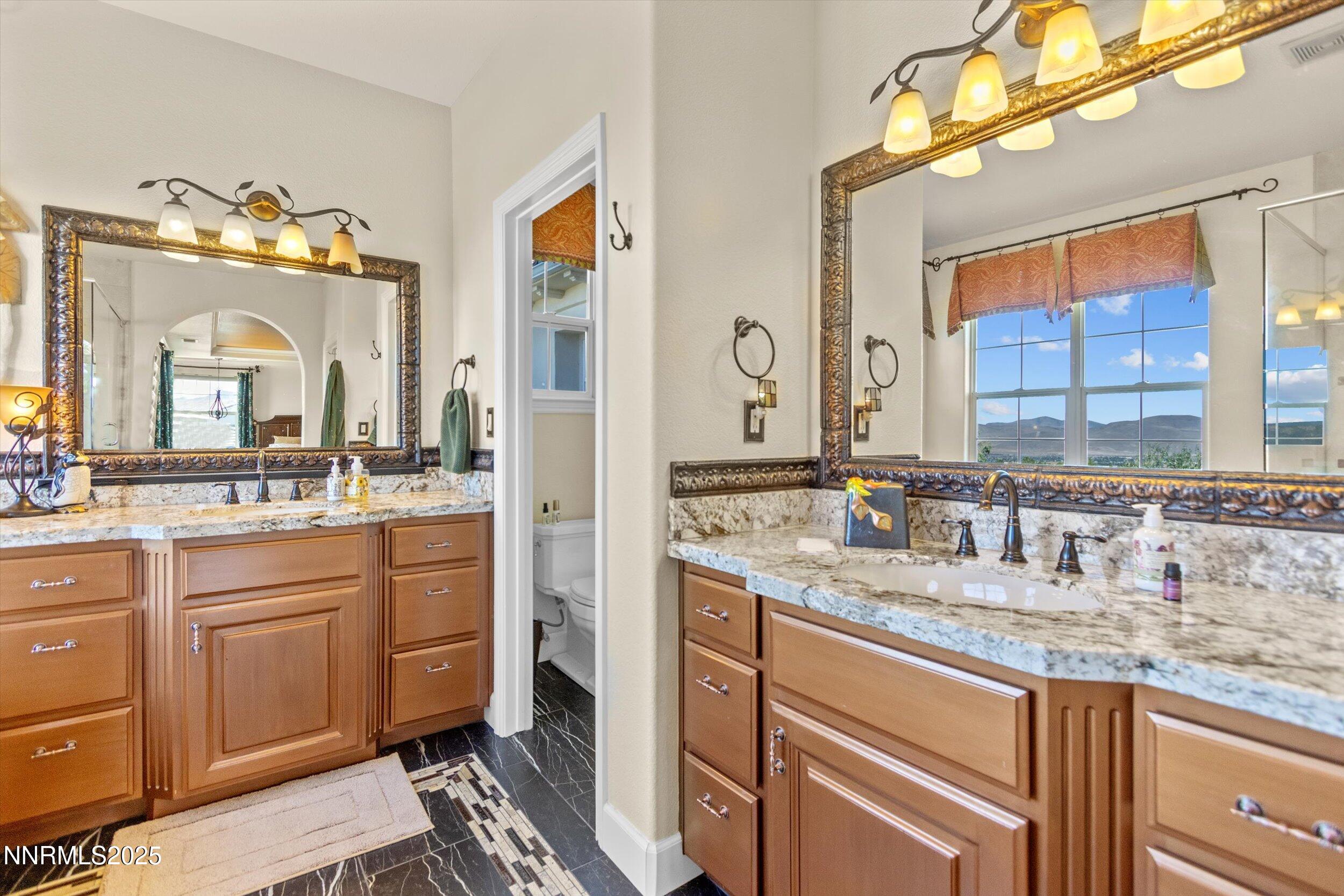 2966 Eagle Rock Court Reno, NV 89511 - Photo 37 of 73 a bathroom with a sink double vanity and a mirror